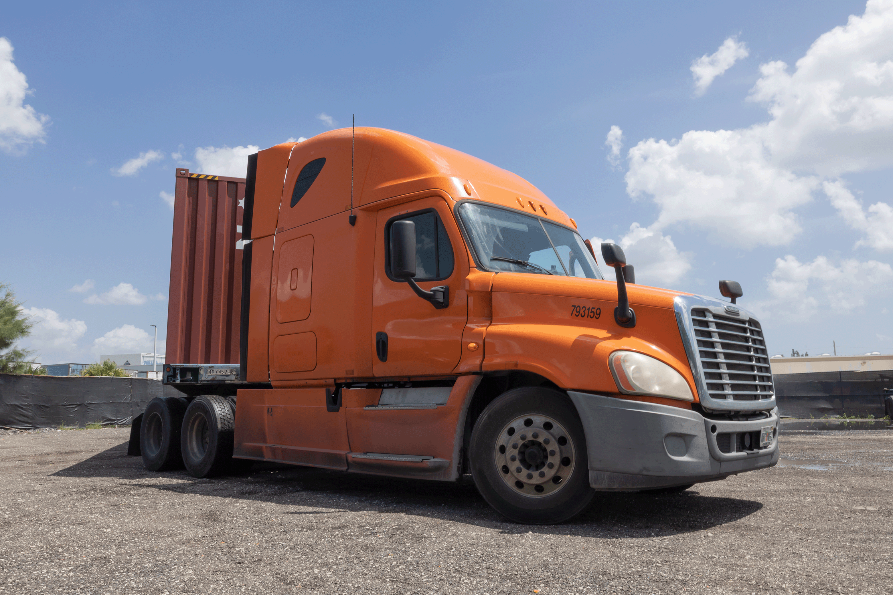 Container drayage truck parked in yard