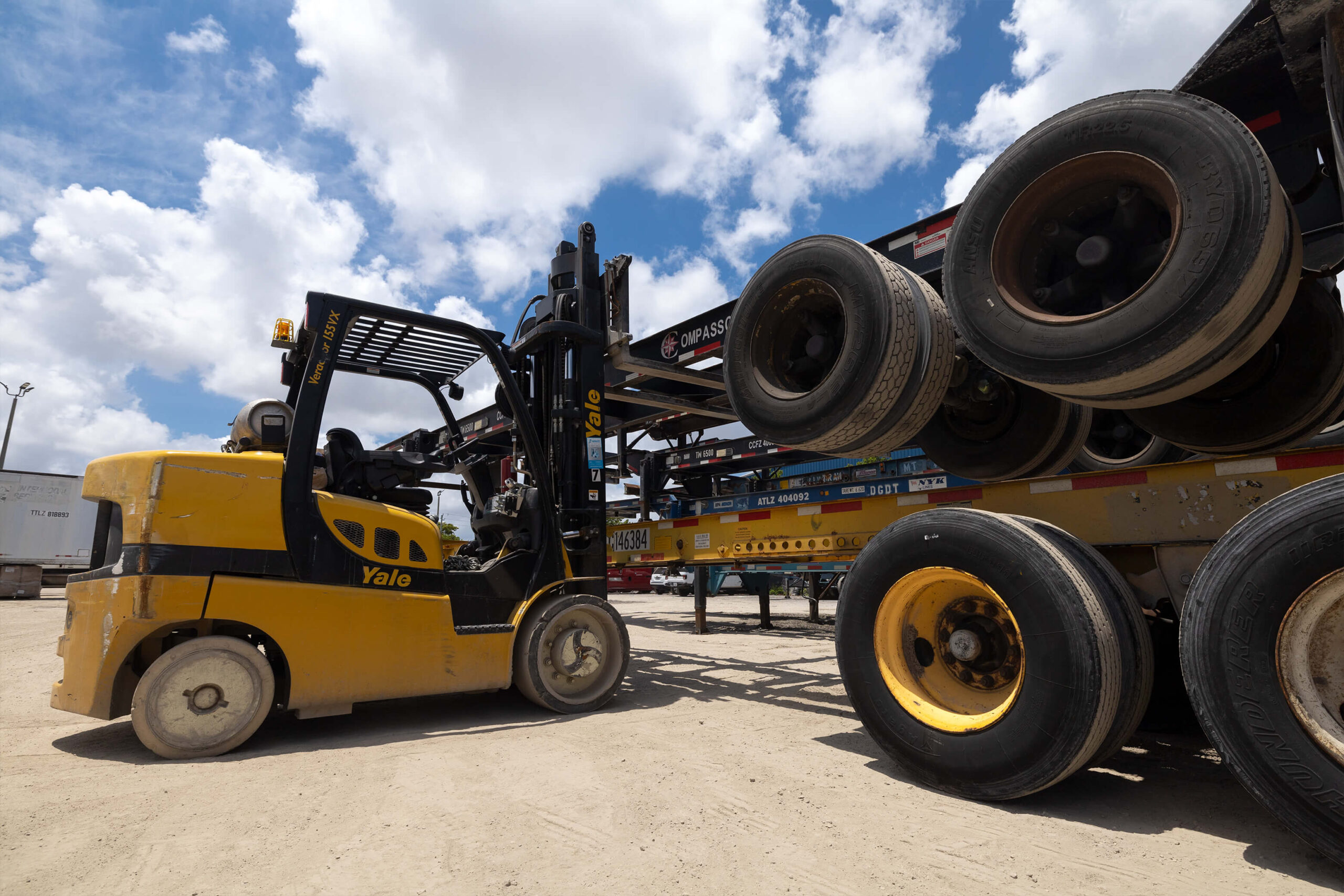 forklift stacking chassis in yard