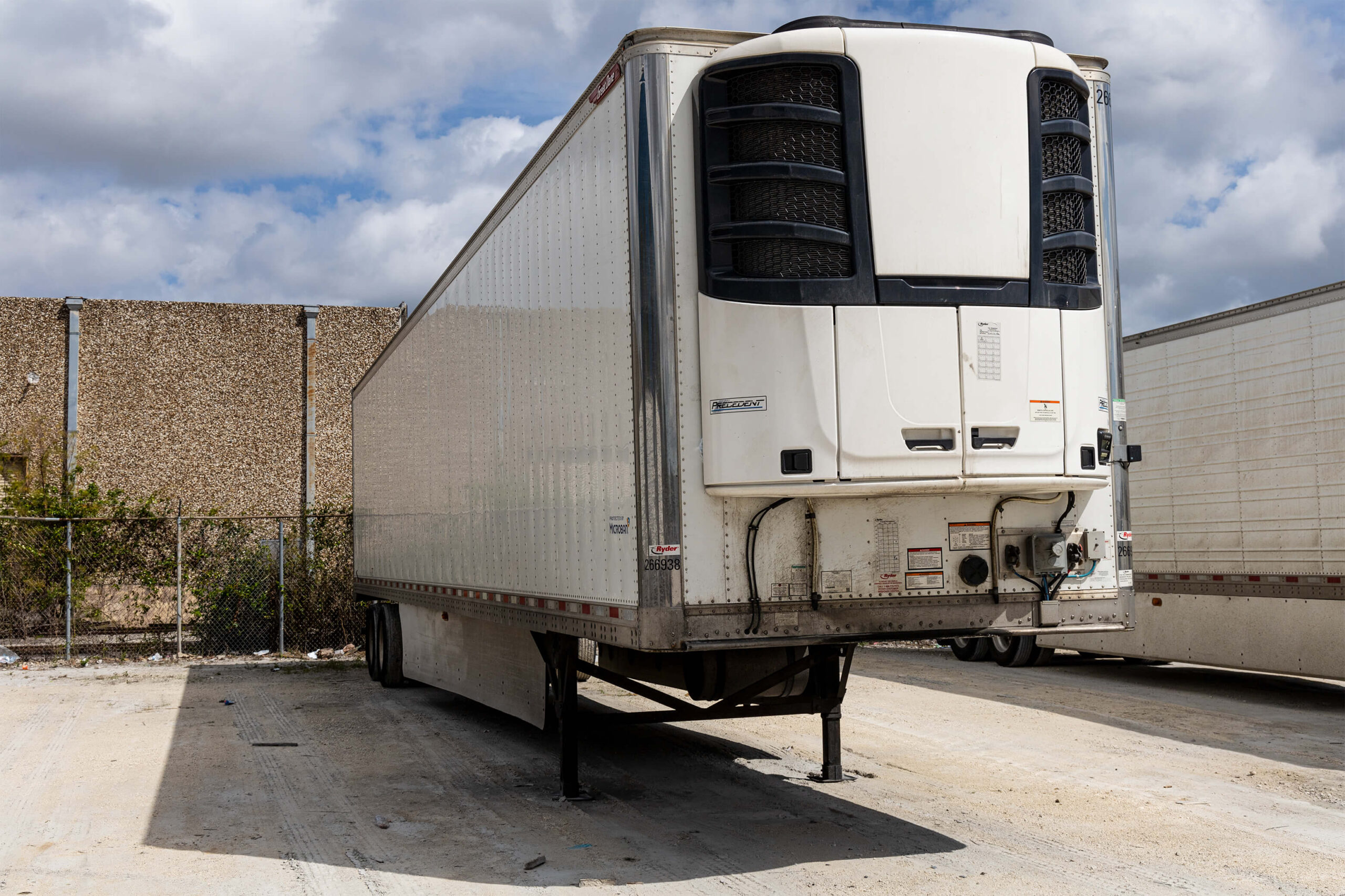 Refrigerated truck parked in yard