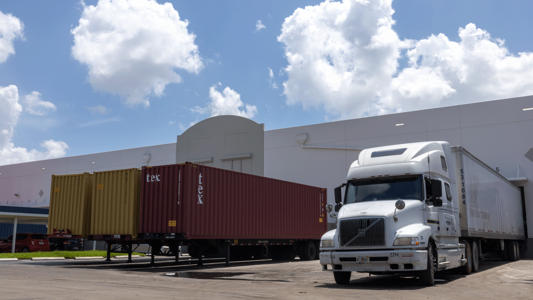 Containers and truck docked at container freight station